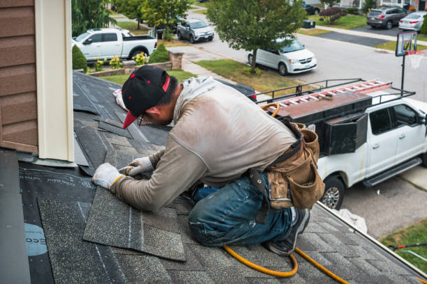 Professional Roofing technician working in Corona, NY